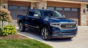 The 2022 Ram 1500 in a driveway in front of a house.